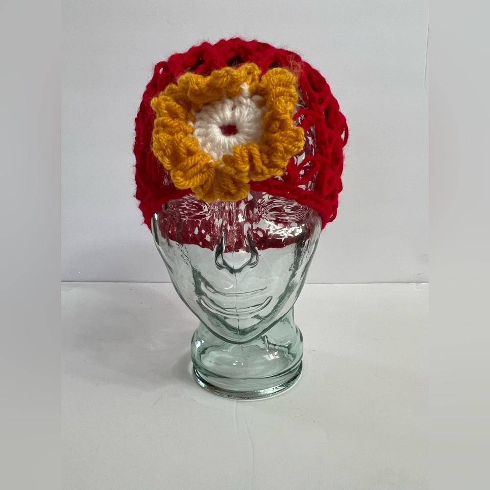 RED CROCHET HAT WITH A YELLOW FLOWER